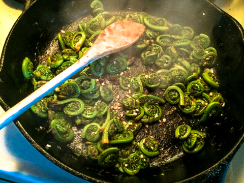 race out to farmers market and grab fistfuls of fiddleheads before they are all gone. </br>rinse. </br>boil (5-7min). </br>olive oil shmolive oil - go for the butter! (with a clove or 2 of garlic and a pinch of kosher salt). </br>drool. </br>enjoy.
