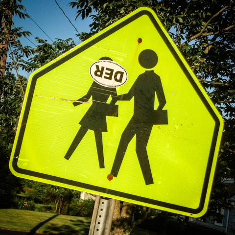 sign of sardonic students crossing