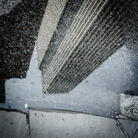 building asphalt puddle dreams at 59th & 5th