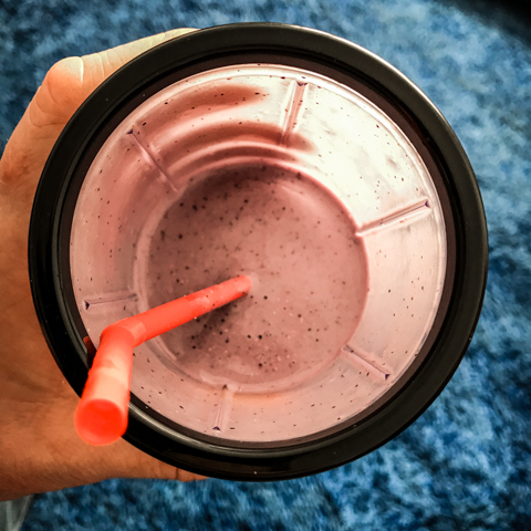 vanilla shakeology® with blueberries over blue shag carpet