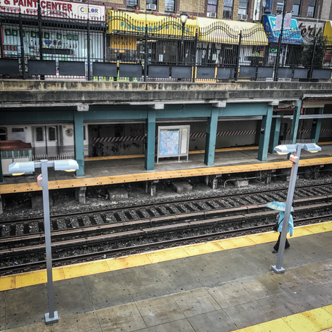 "I'm above ground, yes... the train is definitely leaving the station... also a lady with an umbrella..."